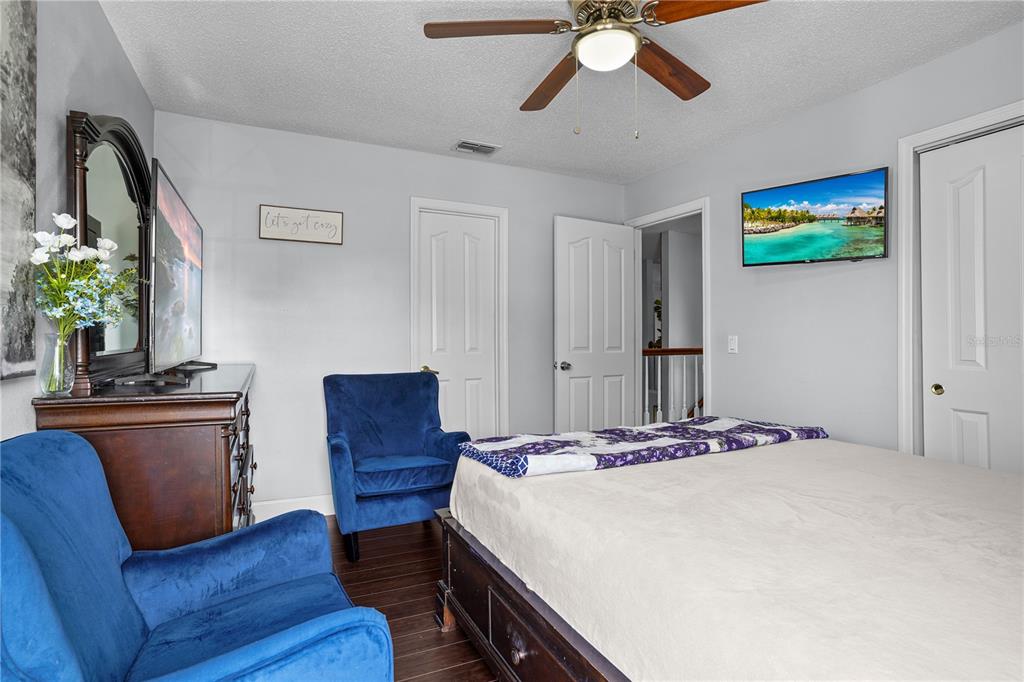 2619 Rangeley Court Orlando, FL 32835 - Photo 44 of 59 a bedroom with a bed and a dresser