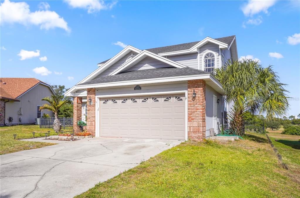 2619 Rangeley Court Orlando, FL 32835 - Photo 5 of 59 a front view of a house with a yard