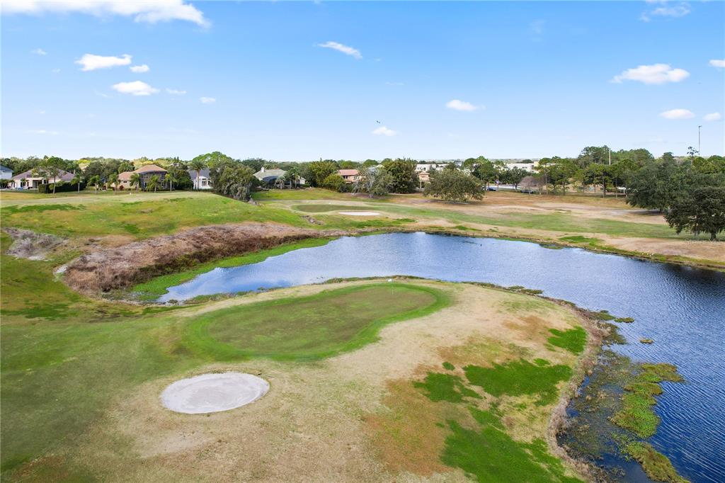 2619 Rangeley Court Orlando, FL 32835 - Photo 56 of 59 a view of swimming pool with seating area and green space