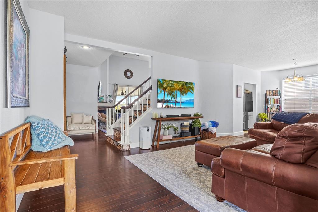 2619 Rangeley Court Orlando, FL 32835 - Photo 9 of 59 a living room with furniture and a wooden floor
