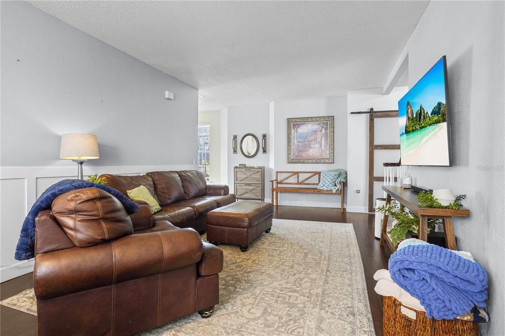 2619 Rangeley Court Orlando, FL 32835 - Photo 10 of 59 a living room with furniture and a lamp