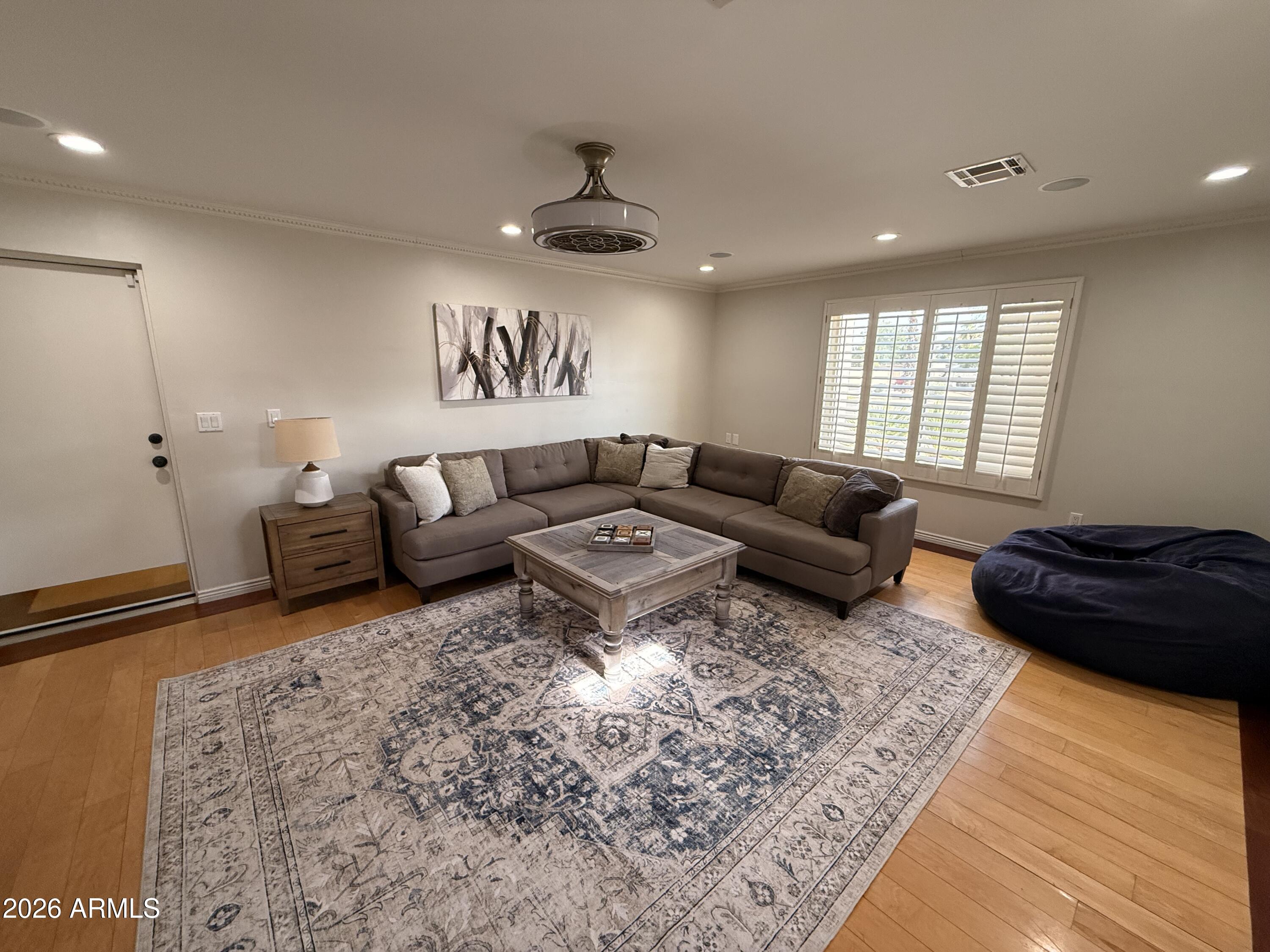 6932 East Presidio Road Scottsdale, AZ 85254 - Photo 25 of 30 a living room with furniture and a rug