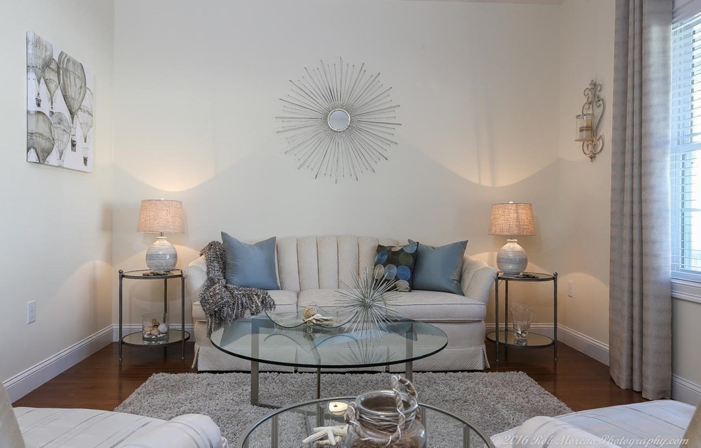 3 Dunrobin Circle, Unit 3 Methuen, MA 01844 - Photo 13 of 28 a living room with furniture and a chandelier