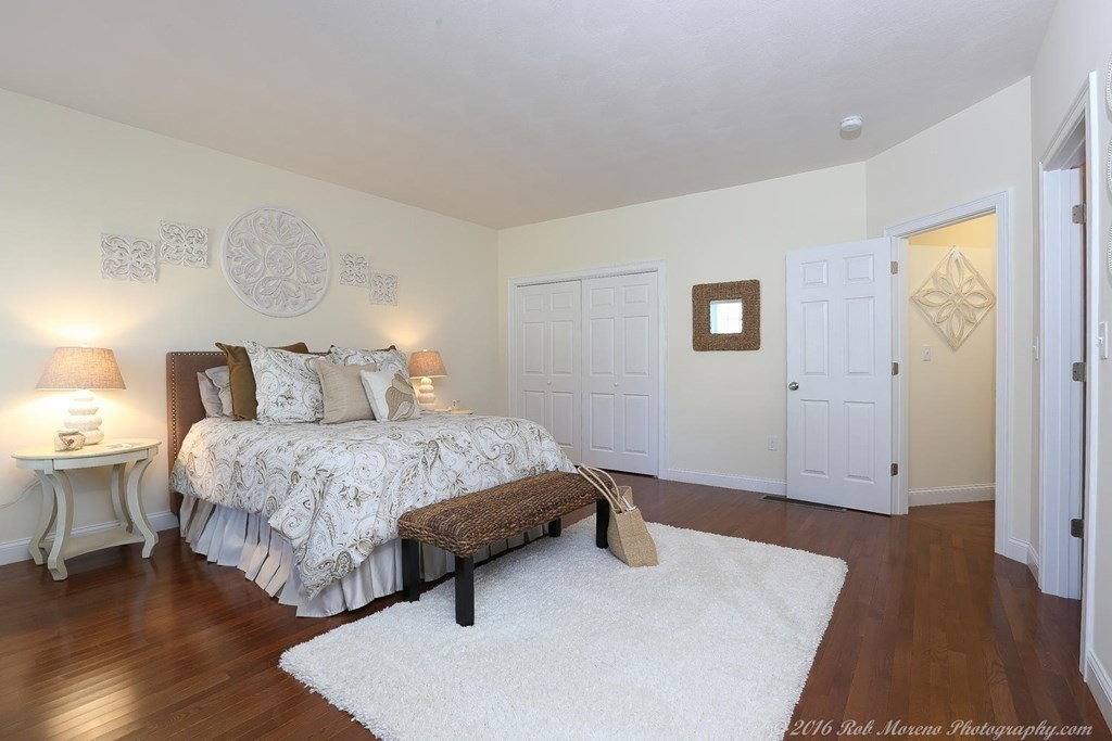 3 Dunrobin Circle, Unit 3 Methuen, MA 01844 - Photo 16 of 28 a bedroom with a bed and wooden floor