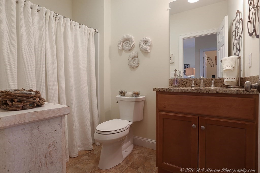 3 Dunrobin Circle, Unit 3 Methuen, MA 01844 - Photo 19 of 28 a bathroom with a sink a toilet and a mirror