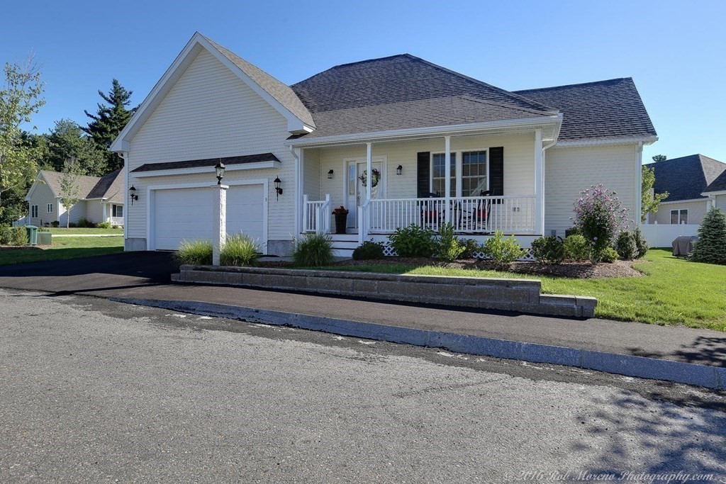 3 Dunrobin Circle, Unit 3 Methuen, MA 01844 - Photo 21 of 28 a front view of a house with a yard and potted plants