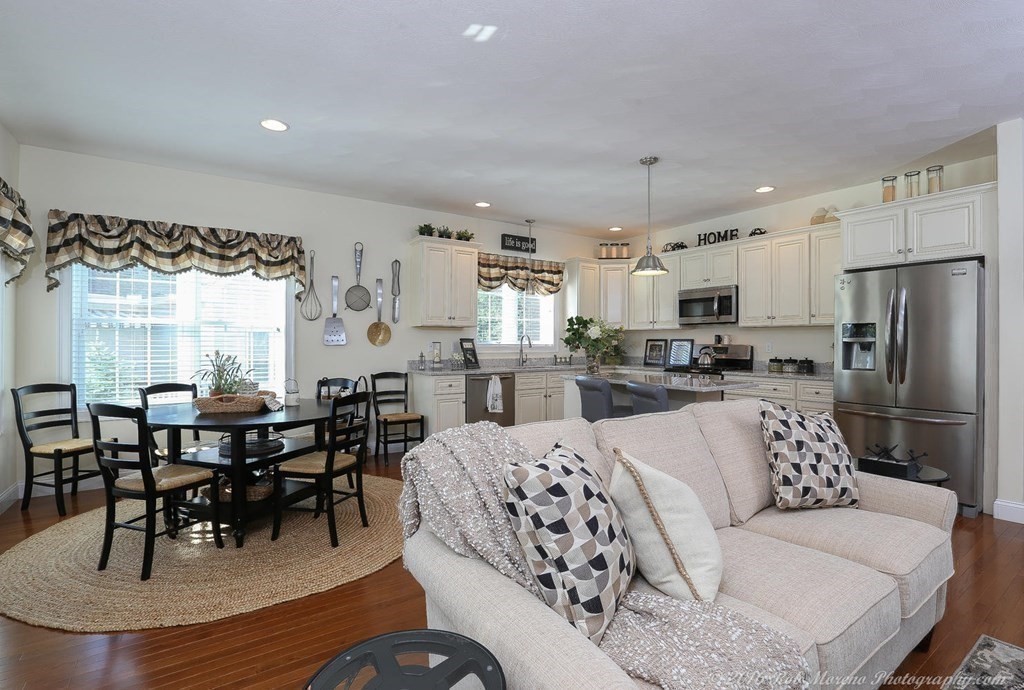 3 Dunrobin Circle, Unit 3 Methuen, MA 01844 - Photo 3 of 28 a living room with furniture a dining table and kitchen view