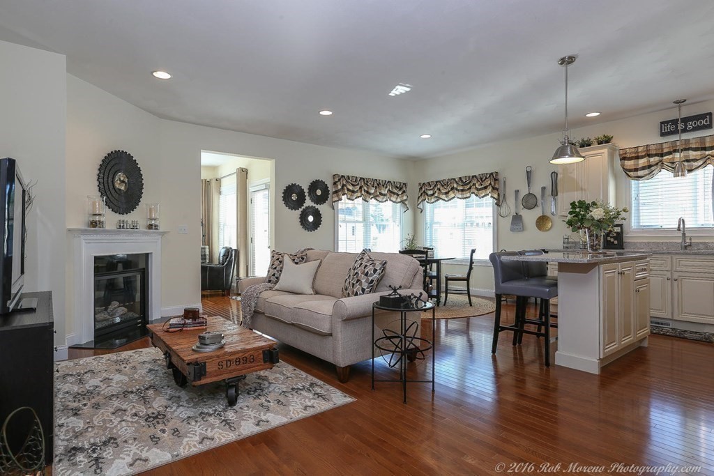 3 Dunrobin Circle, Unit 3 Methuen, MA 01844 - Photo 4 of 28 a living room with fireplace furniture and a wooden floor