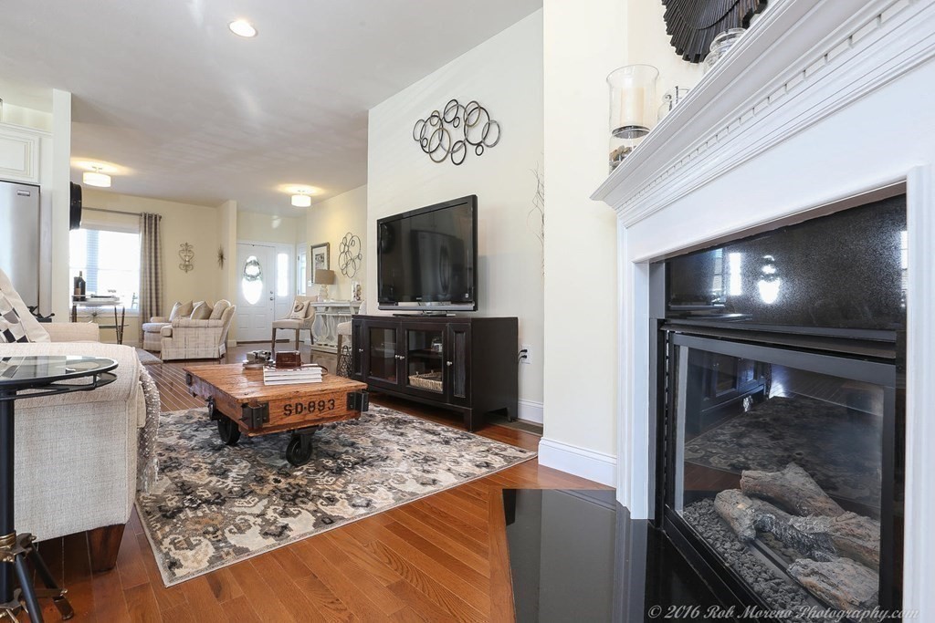 3 Dunrobin Circle, Unit 3 Methuen, MA 01844 - Photo 5 of 28 a living room with furniture and a flat screen tv