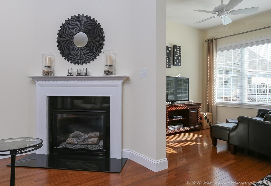 3 Dunrobin Circle, Unit 3 Methuen, MA 01844 - Photo 6 of 28 a living room with furniture and a fireplace