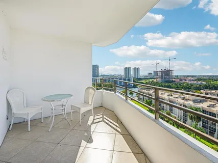 a view of balcony with furniture