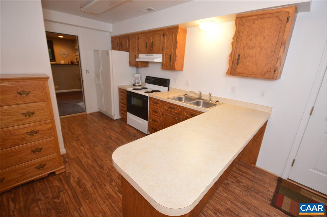162 Stephens Loop Ruckersville, VA 22968 - Photo 14 of 29 a kitchen with a refrigerator and a stove top oven