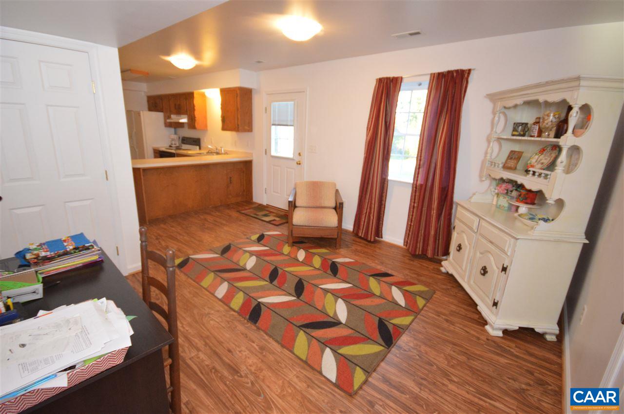 162 Stephens Loop Ruckersville, VA 22968 - Photo 17 of 29 a living room with blue walls and furniture