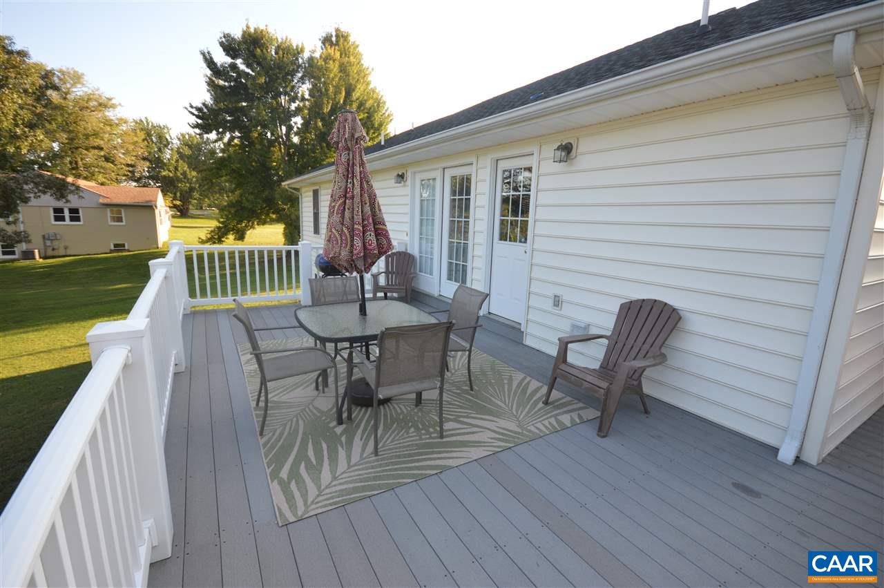 162 Stephens Loop Ruckersville, VA 22968 - Photo 26 of 29 a view of a deck with table and chairs with wooden floor and fence
