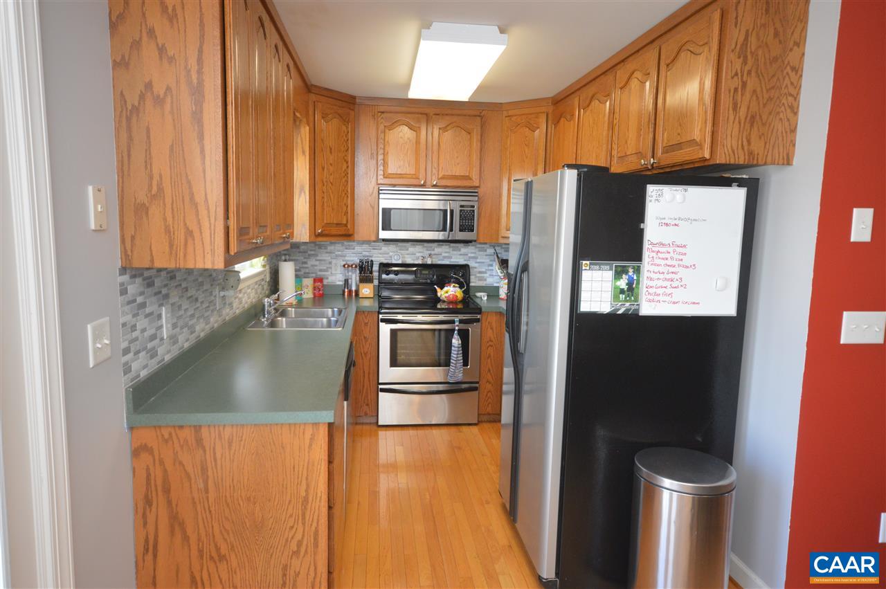 162 Stephens Loop Ruckersville, VA 22968 - Photo 29 of 29 a kitchen with a sink a stove and a refrigerator