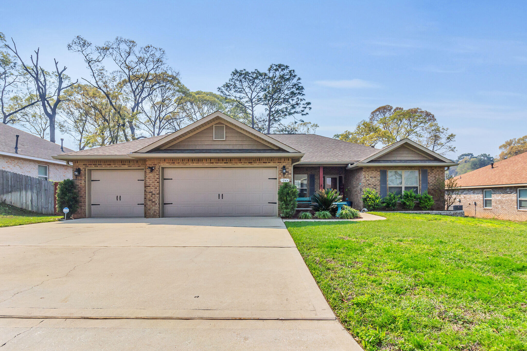 3044 Crown Creek Circle Crestview, FL 32539 - Photo 1 of 41 a front view of a house with a yard and garage