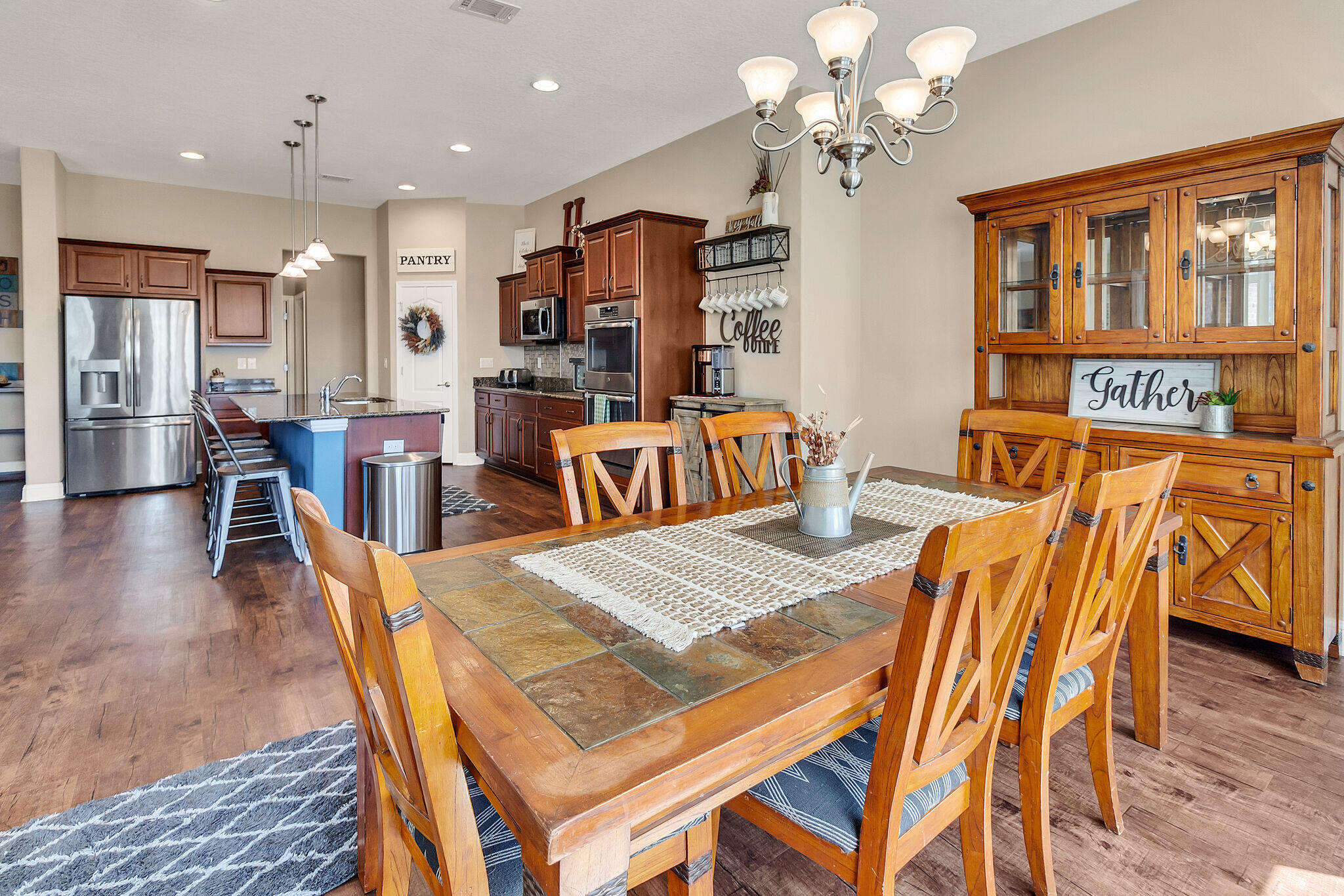 3044 Crown Creek Circle Crestview, FL 32539 - Photo 18 of 41 a view of a dining room with furniture and wooden floor