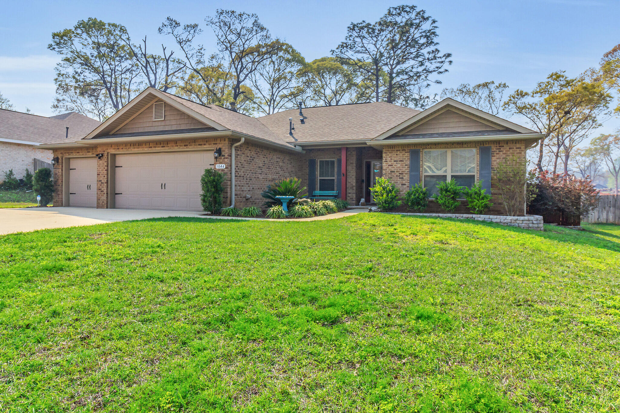3044 Crown Creek Circle Crestview, FL 32539 - Photo 2 of 41 a front view of a house with a yard and garage