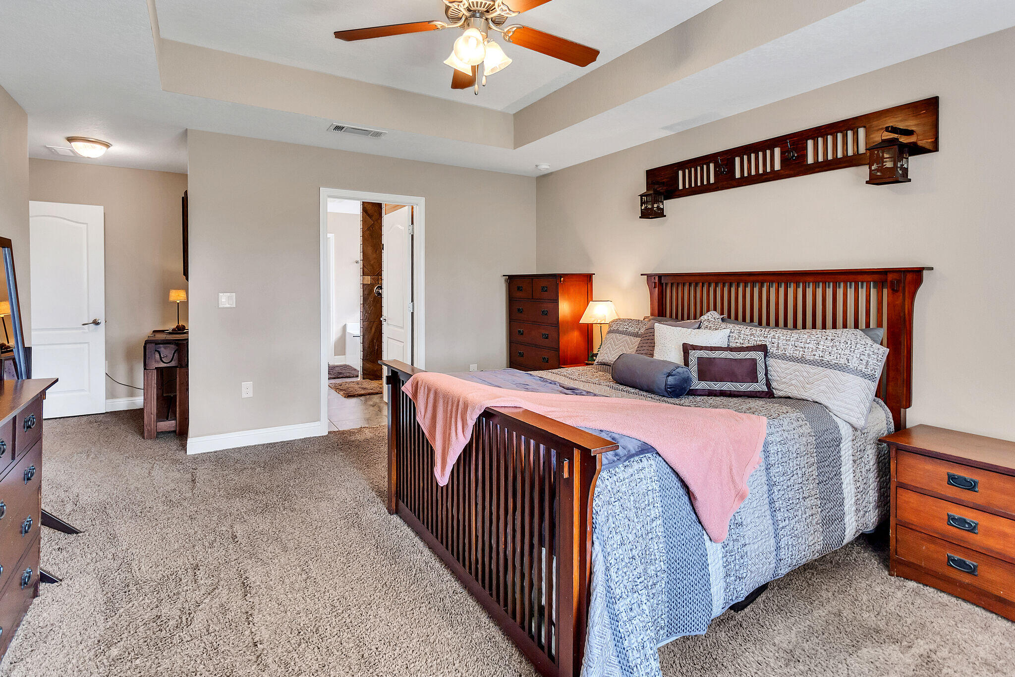 3044 Crown Creek Circle Crestview, FL 32539 - Photo 21 of 41 a bedroom with a bed and a chandelier