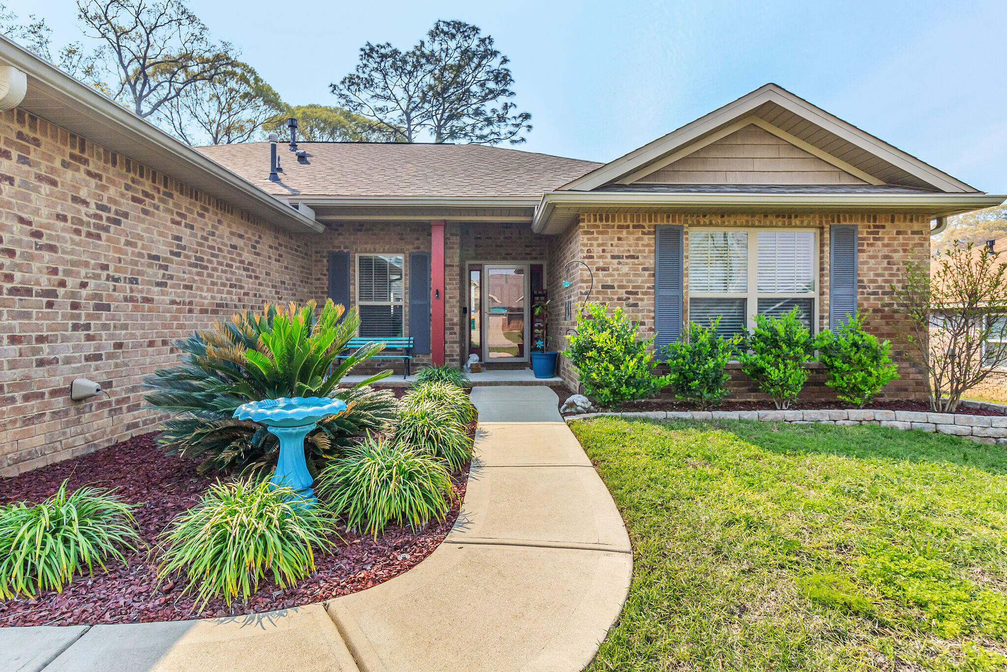 3044 Crown Creek Circle Crestview, FL 32539 - Photo 3 of 41 a front view of a house with a garden