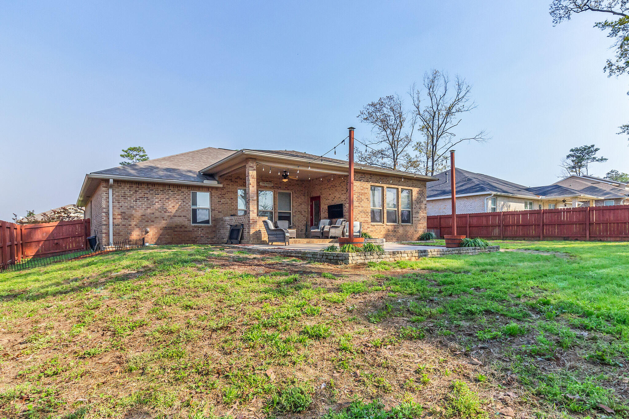 3044 Crown Creek Circle Crestview, FL 32539 - Photo 38 of 41 a view of a house with backyard porch and furniture