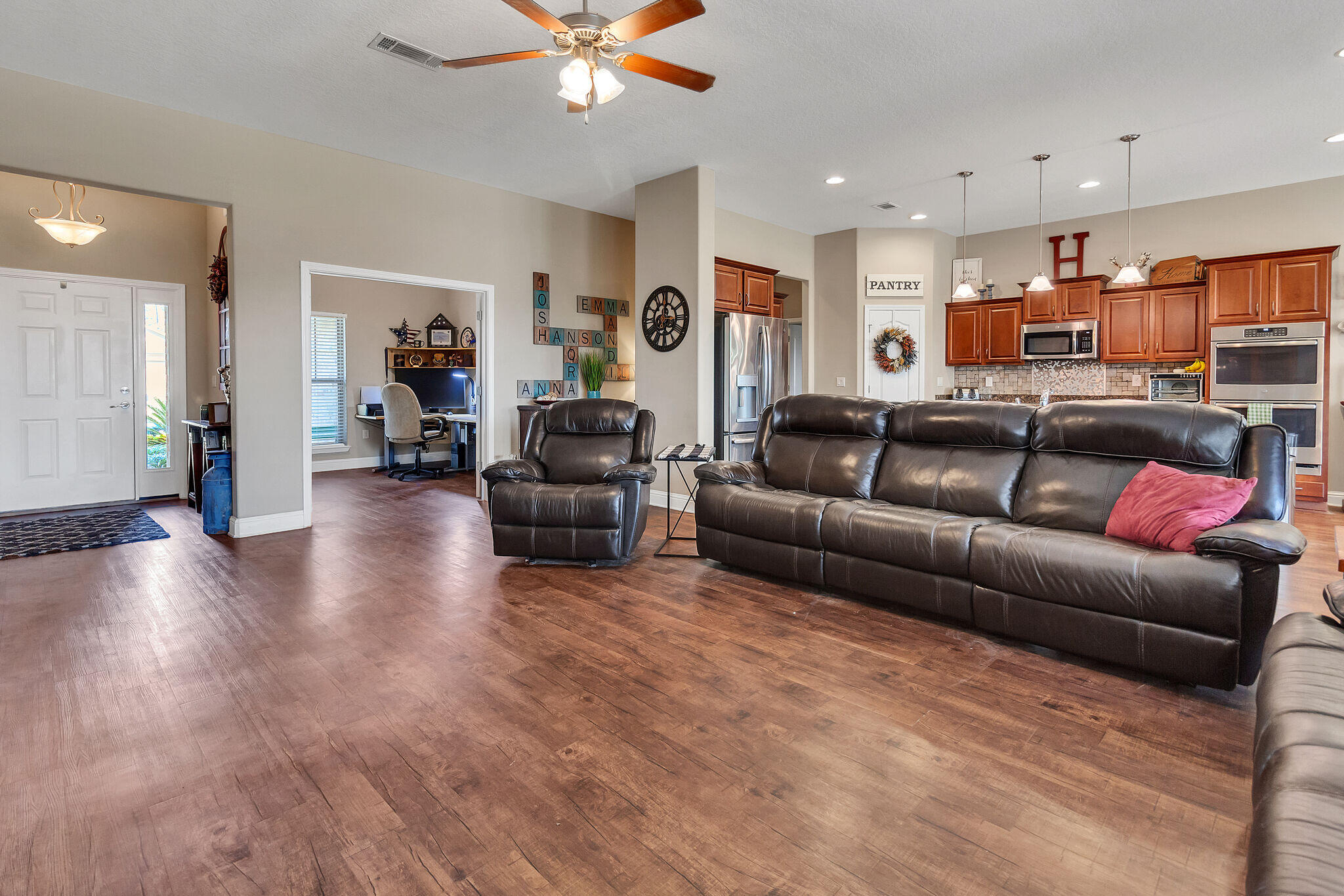 3044 Crown Creek Circle Crestview, FL 32539 - Photo 7 of 41 a living room with furniture and wooden floor