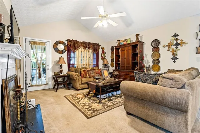 a living room with furniture fireplace and a flat screen tv