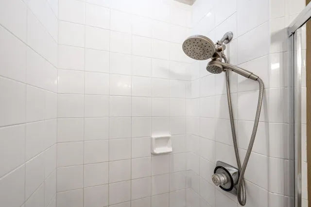 a bathroom with a toilet a sink and shower