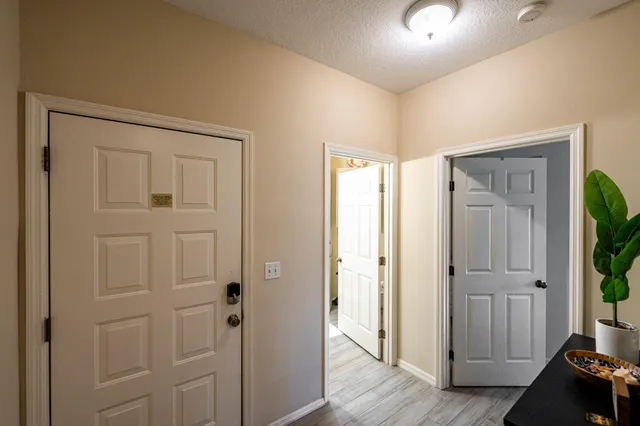 a front view of a building with a garden