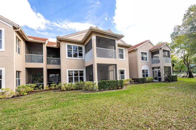 a view of a city with lawn chairs under an umbrella
