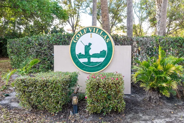 a view of house with yard and swimming pool
