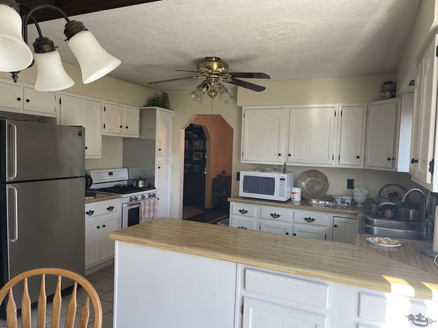 6602 Wander Way Cary, IL 60013 - Photo 12 of 45 a kitchen with stainless steel appliances granite countertop a sink a stove and refrigerator