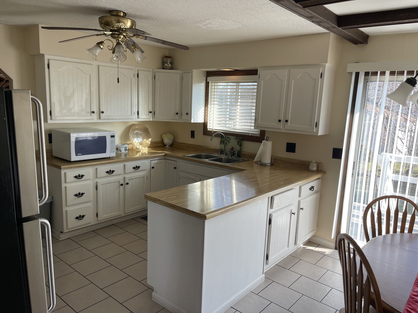 6602 Wander Way Cary, IL 60013 - Photo 13 of 45 a kitchen with granite countertop a sink appliances cabinets and furniture