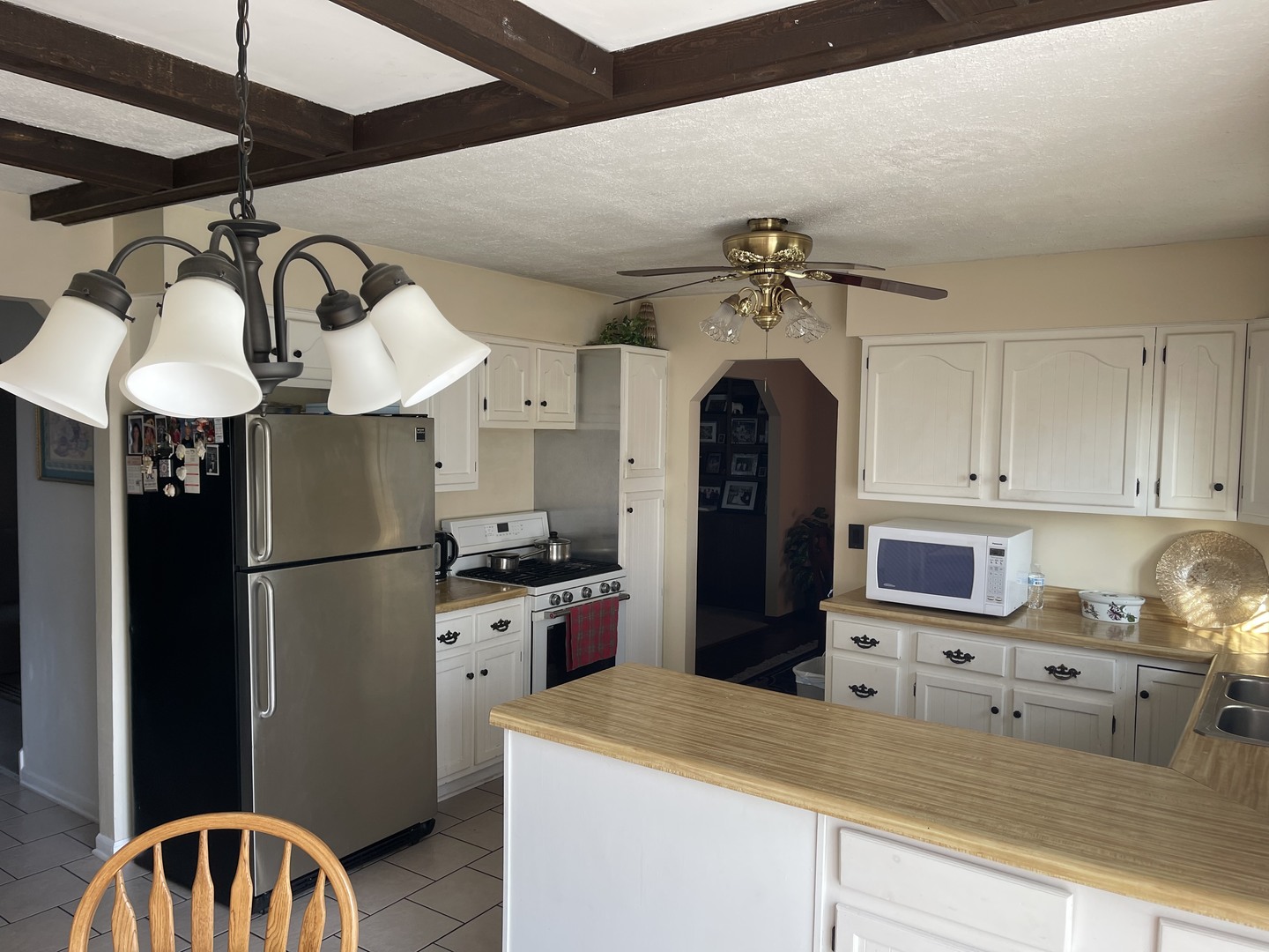 6602 Wander Way Cary, IL 60013 - Photo 14 of 45 a kitchen with stainless steel appliances granite countertop a refrigerator a stove and a sink