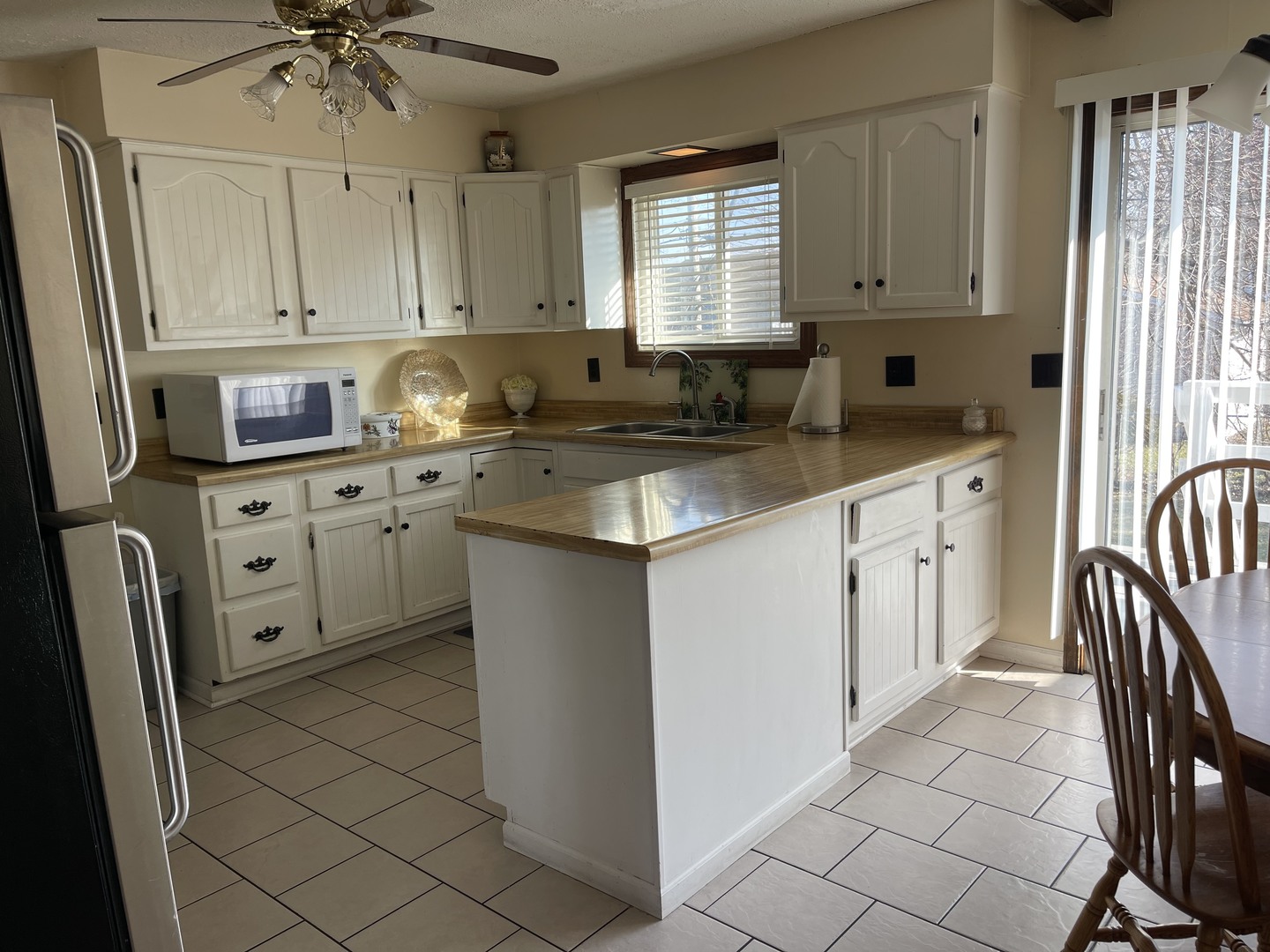 6602 Wander Way Cary, IL 60013 - Photo 15 of 45 a kitchen with stainless steel appliances granite countertop a sink stove and cabinets