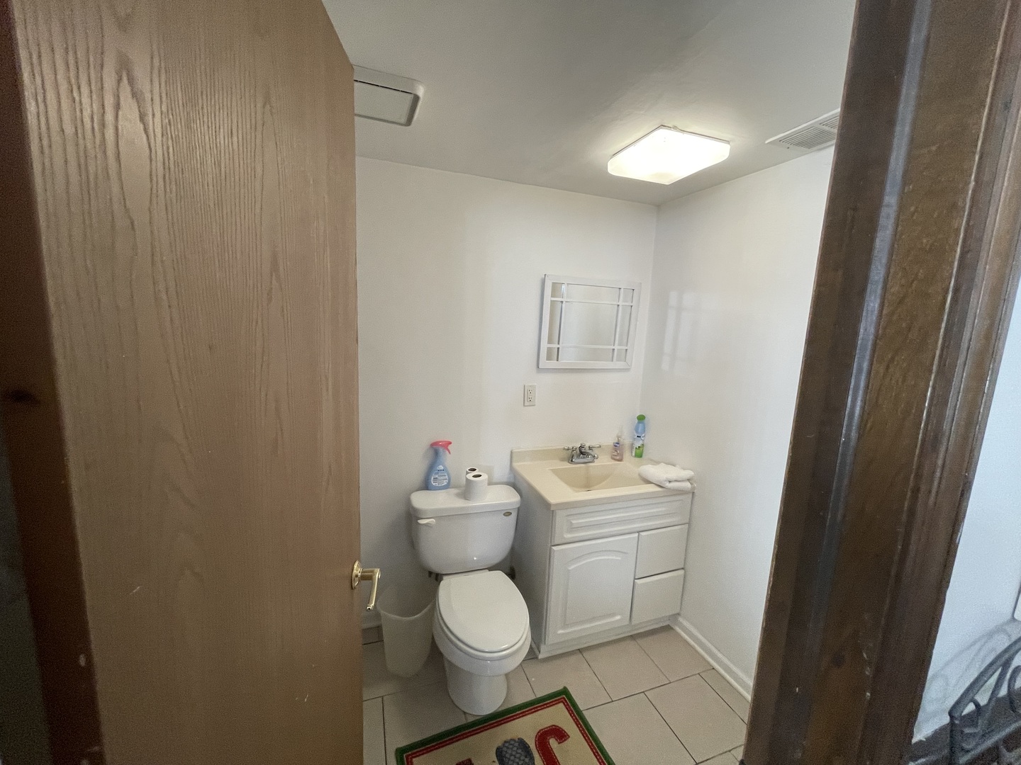 6602 Wander Way Cary, IL 60013 - Photo 32 of 45 a bathroom with a toilet sink and mirror