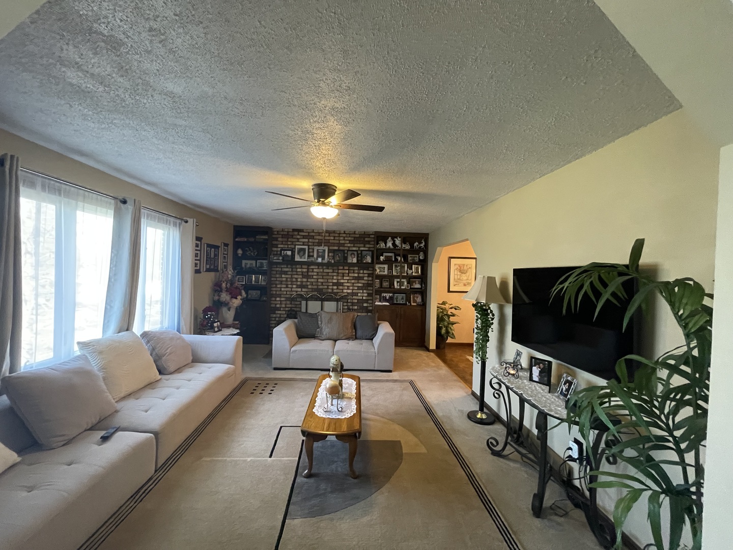 6602 Wander Way Cary, IL 60013 - Photo 5 of 45 a living room with furniture tv and a fireplace