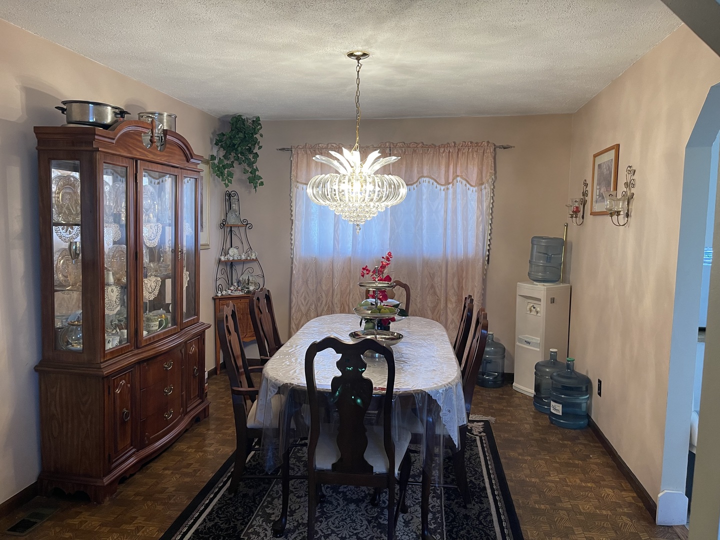 6602 Wander Way Cary, IL 60013 - Photo 9 of 45 a view of a dining room with furniture window and wooden floor