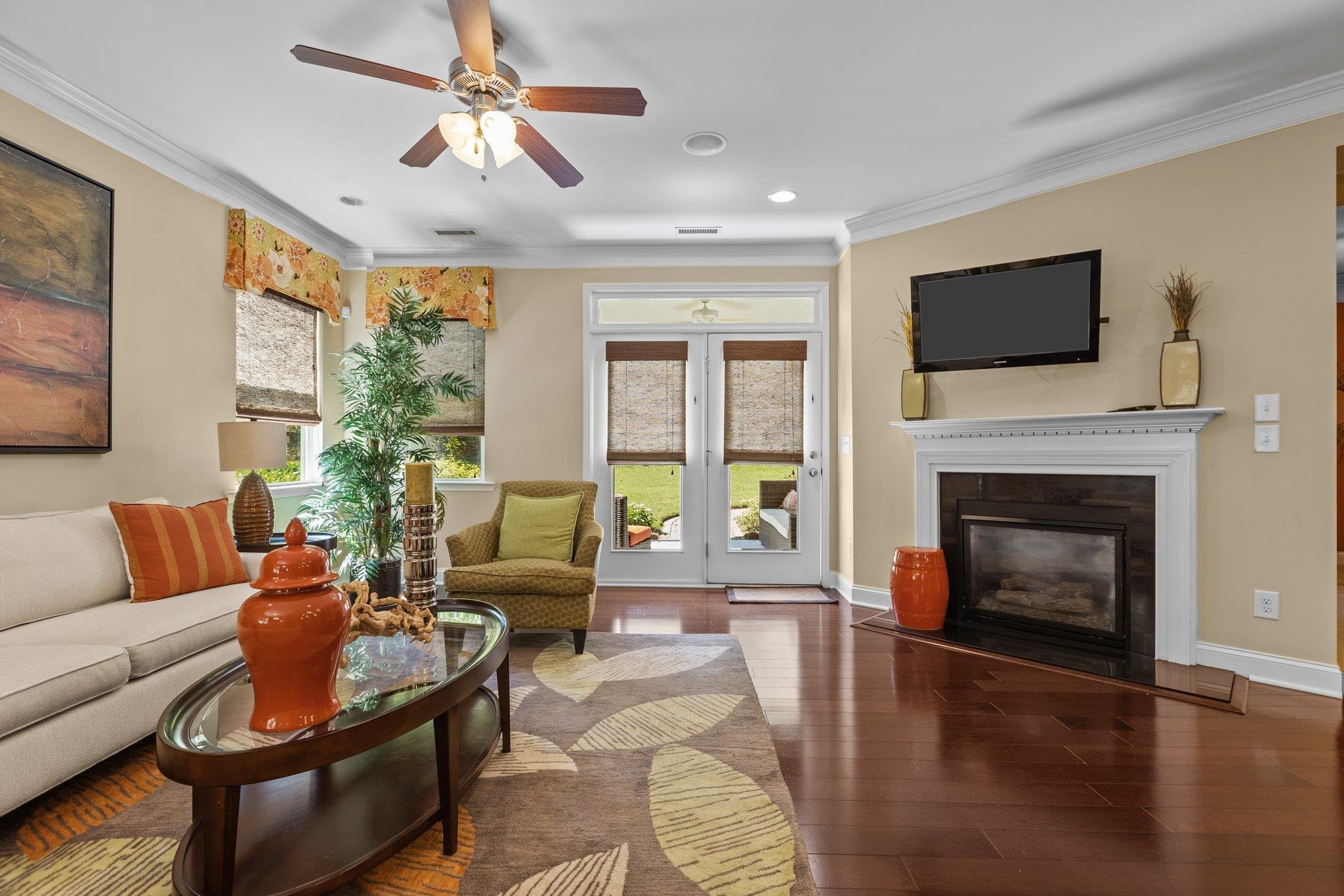 103 Daneborg Road Durham, NC 27703 - Photo 11 of 44 a living room with furniture a flat screen tv and a fireplace