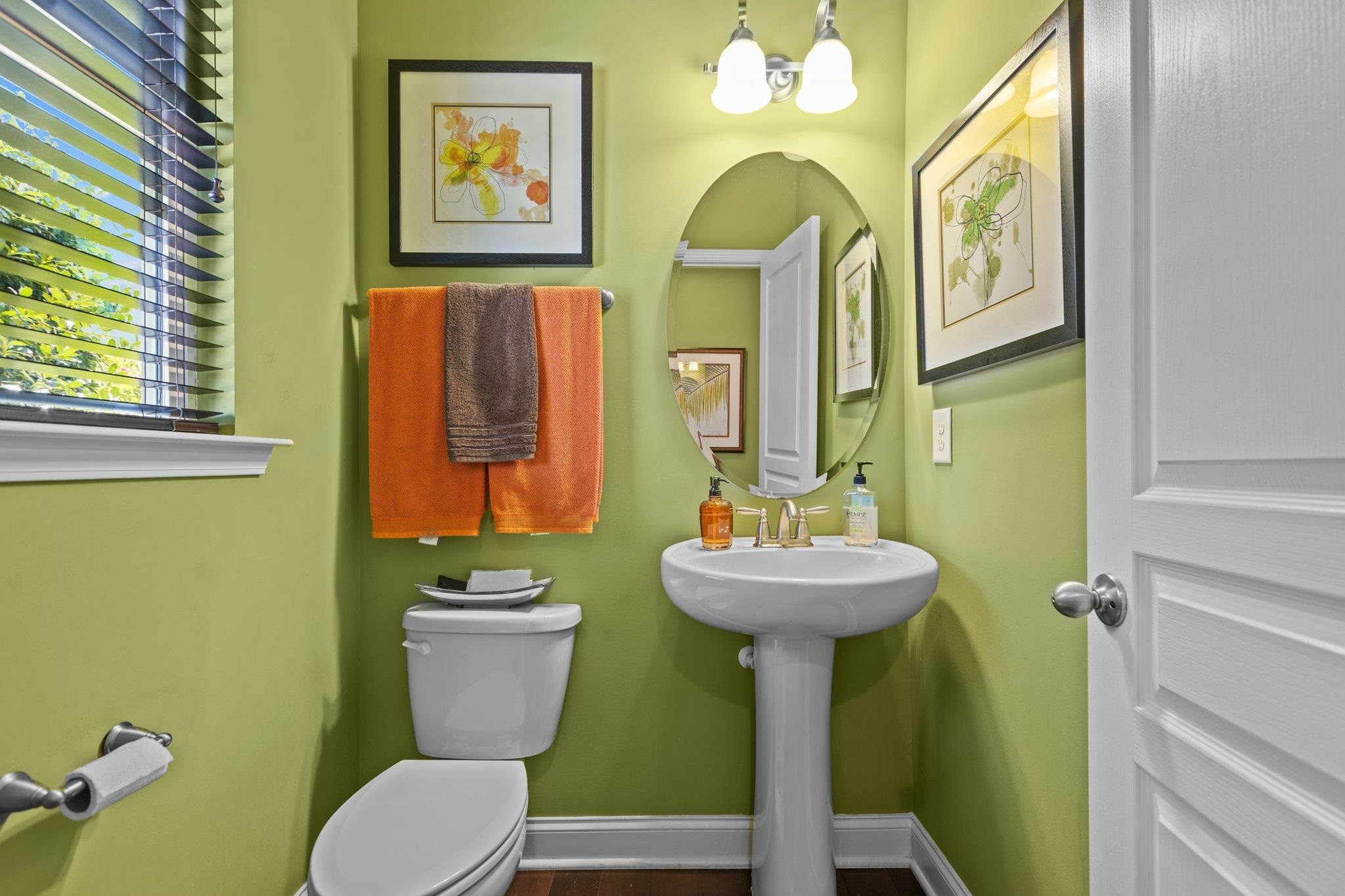 103 Daneborg Road Durham, NC 27703 - Photo 13 of 44 a bathroom with a sink mirror and toilet