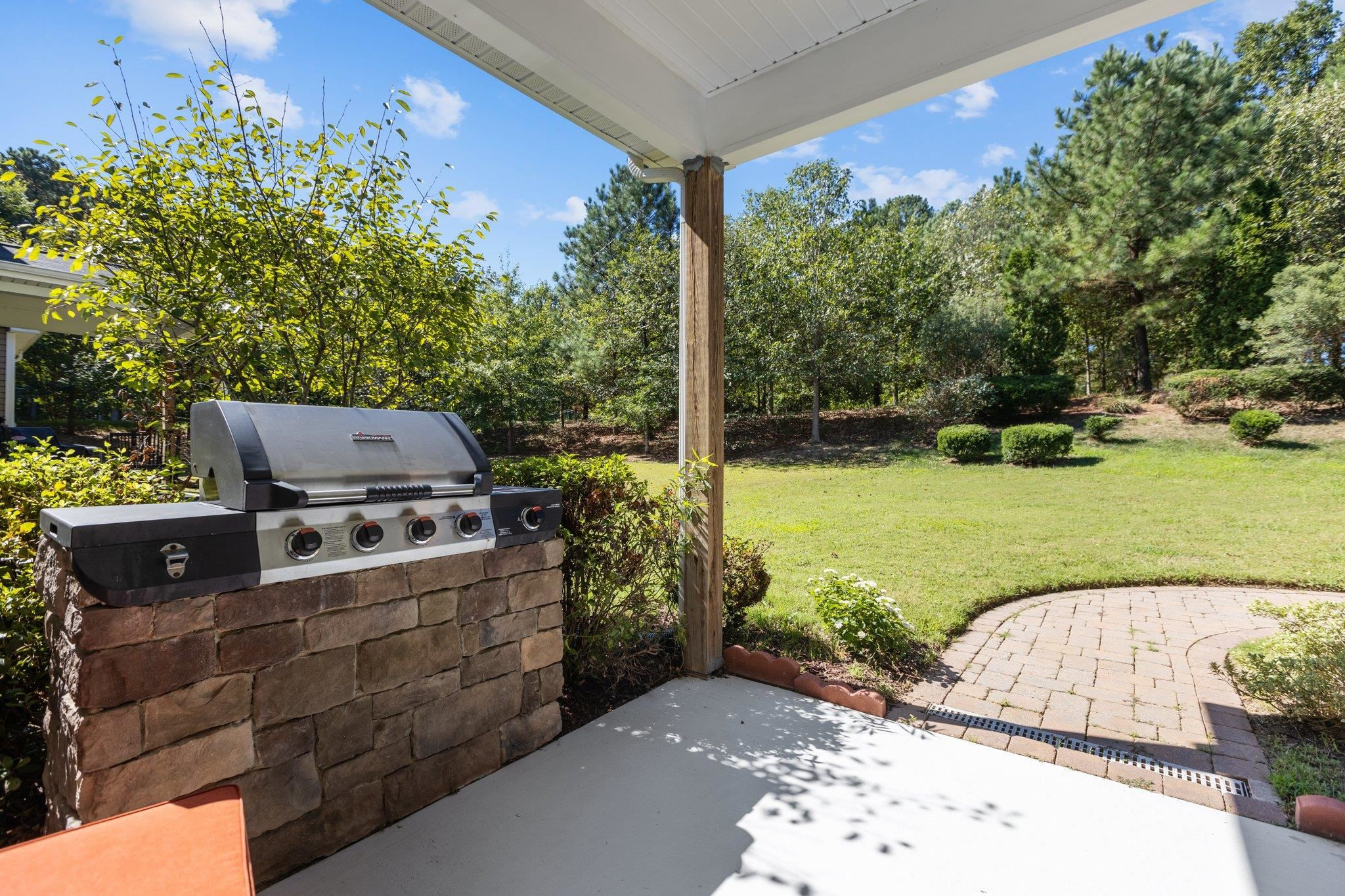 103 Daneborg Road Durham, NC 27703 - Photo 15 of 44 a view of a garden with an outdoor space