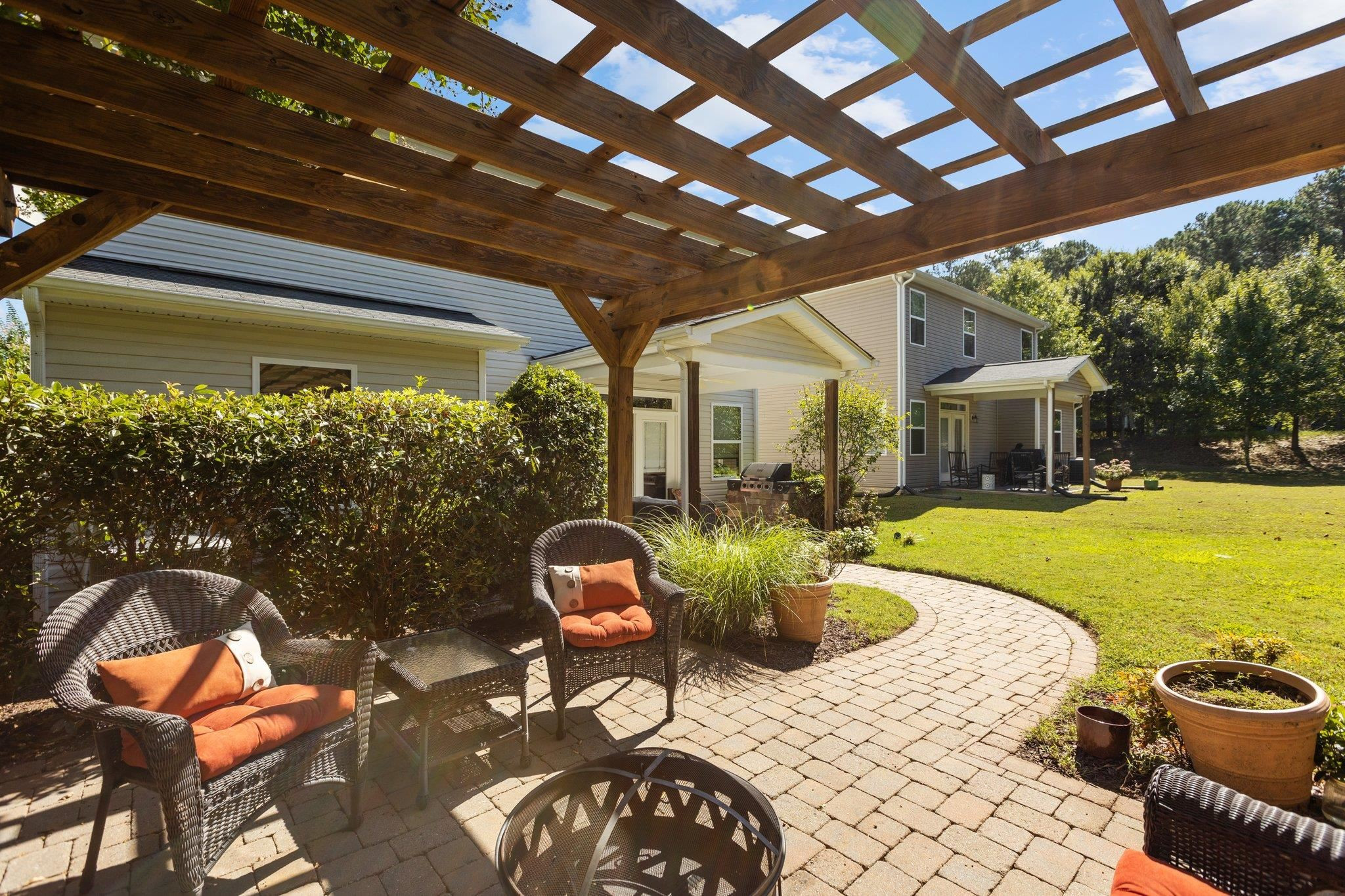 103 Daneborg Road Durham, NC 27703 - Photo 16 of 44 a swimming pool with outdoor seating and yard