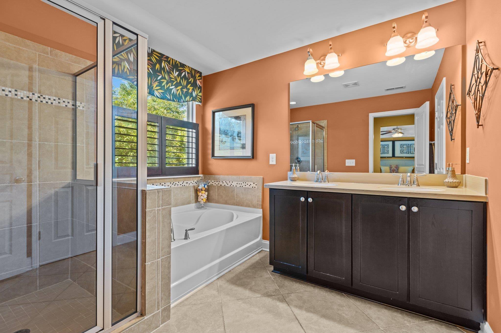 103 Daneborg Road Durham, NC 27703 - Photo 28 of 44 a spacious bathroom with a tub sink shower and mirror