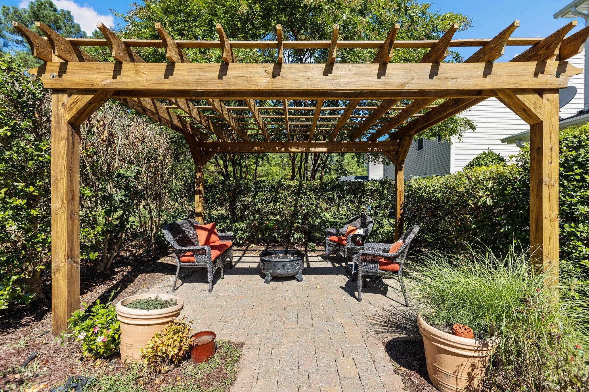 103 Daneborg Road Durham, NC 27703 - Photo 35 of 44 a patio with table and chairs