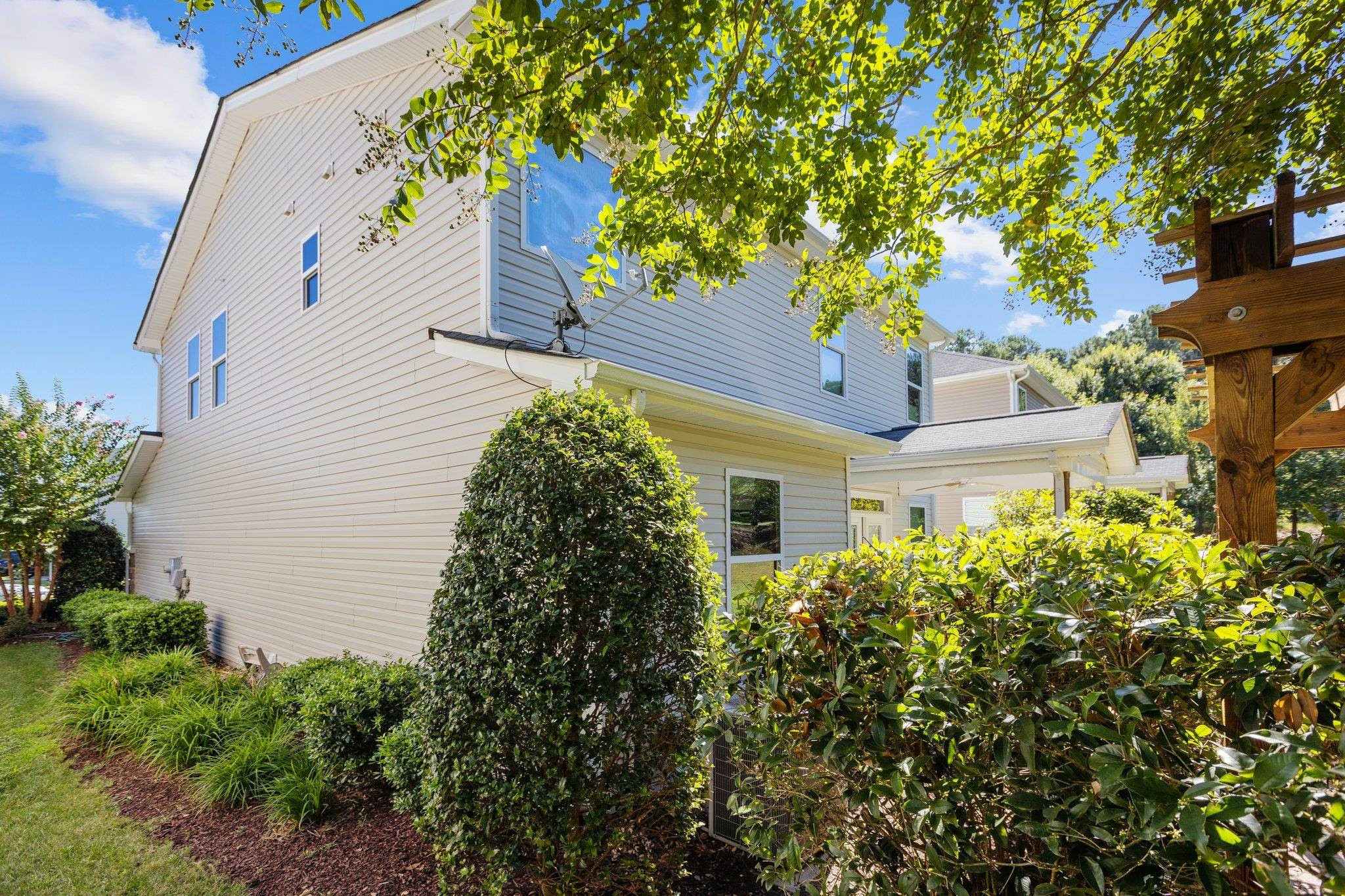 103 Daneborg Road Durham, NC 27703 - Photo 36 of 44 a small garden in the corner of a house
