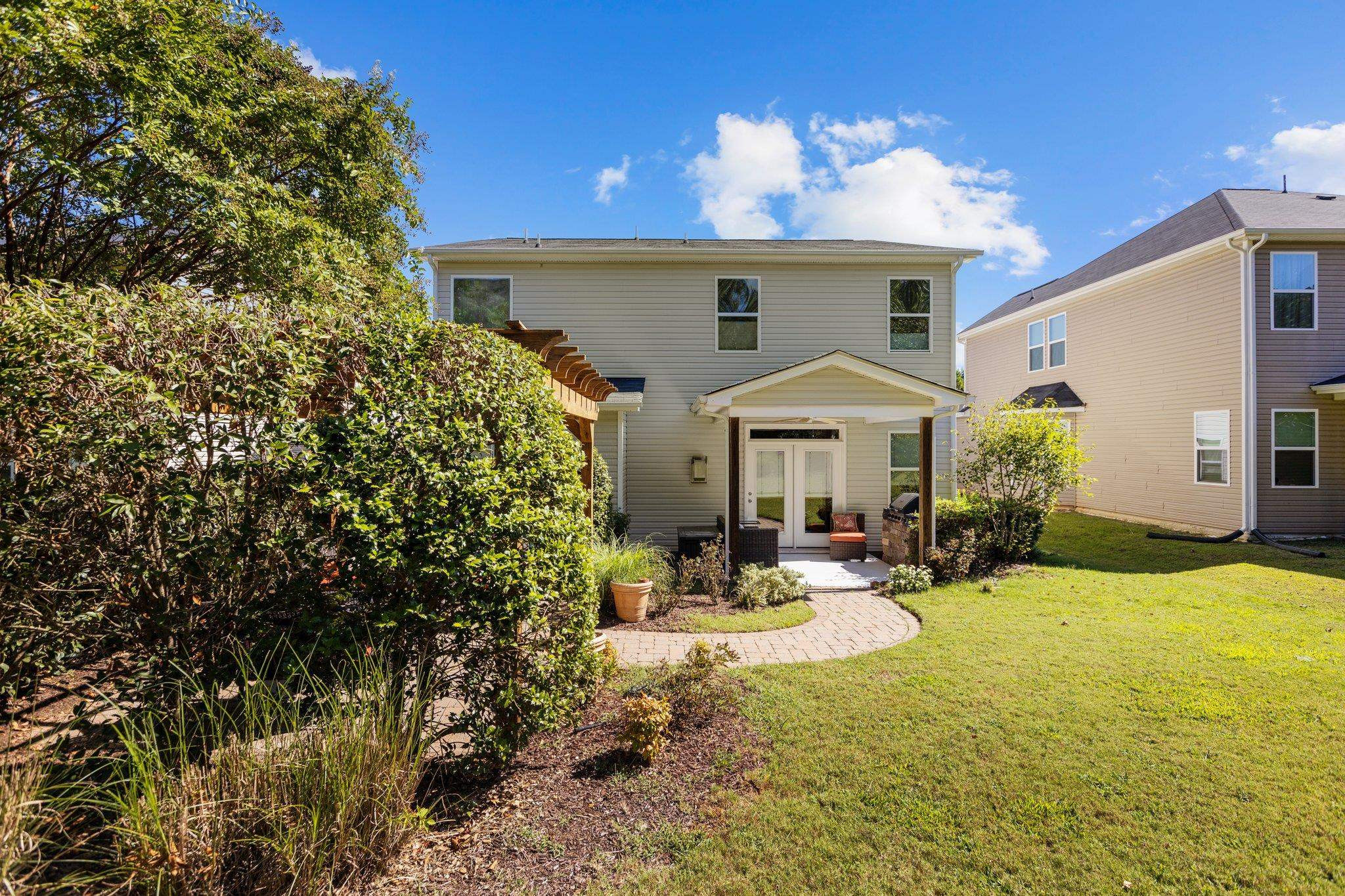 103 Daneborg Road Durham, NC 27703 - Photo 39 of 44 a view of a house with backyard and sitting area