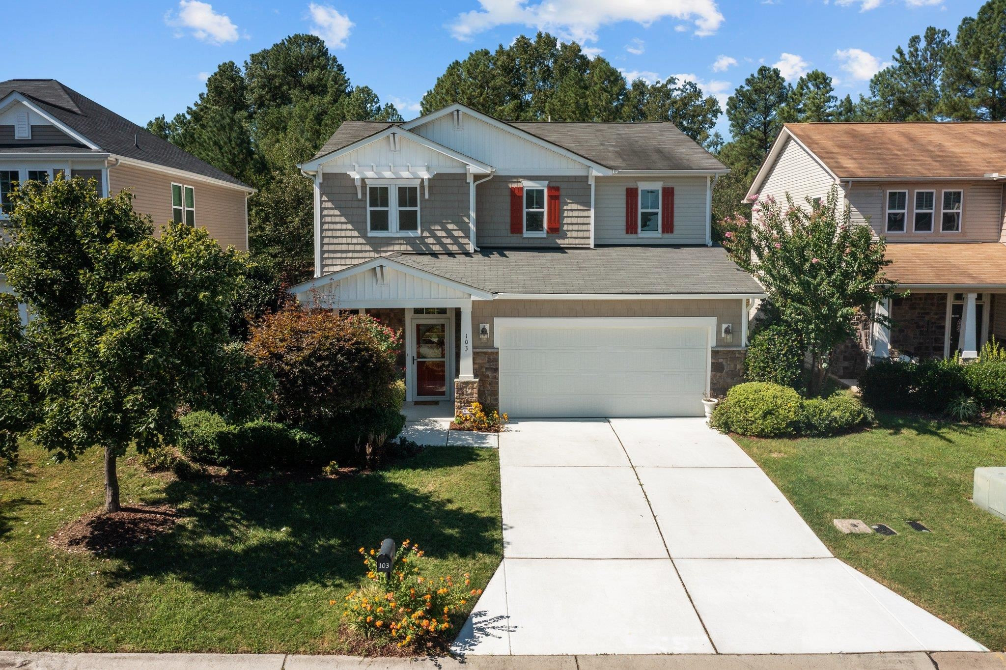 103 Daneborg Road Durham, NC 27703 - Photo 40 of 44 a front view of a house with a garden