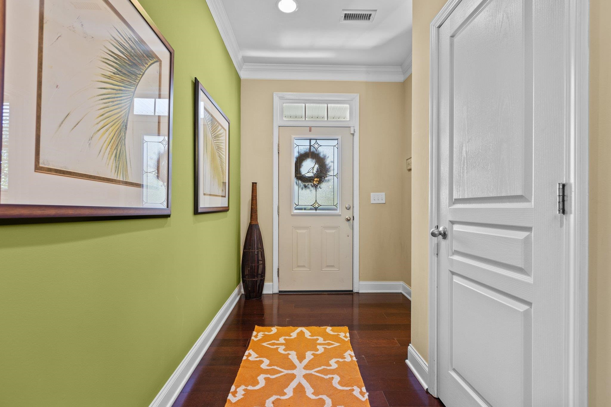 103 Daneborg Road Durham, NC 27703 - Photo 4 of 44 a view of walk in closet with rug and wooden floor
