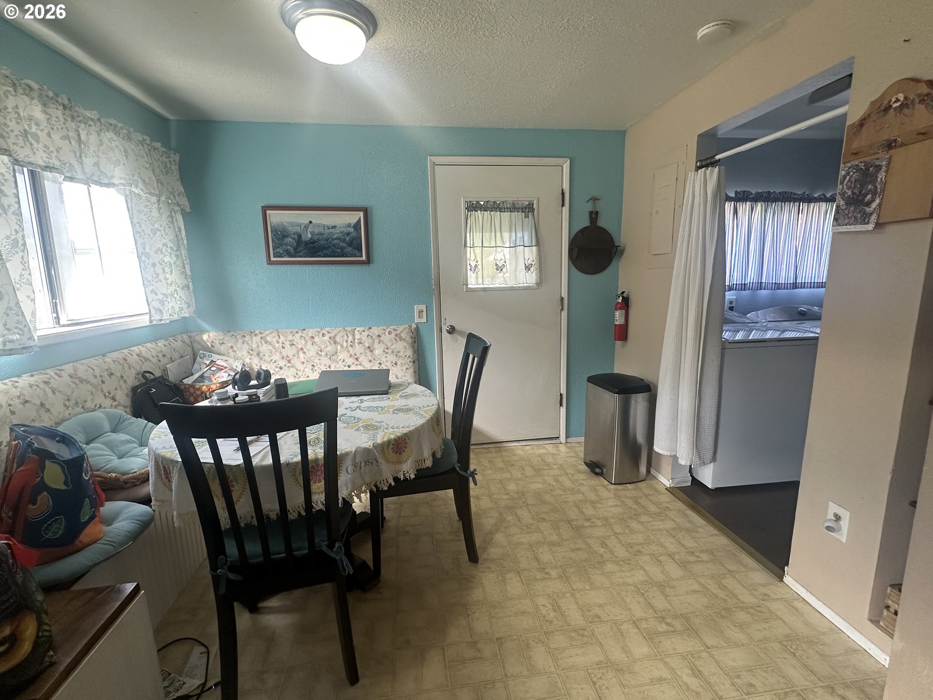 2063 Alder Avenue Reedsport, OR 97467 - Photo 11 of 29 a view of a dining room with furniture and window