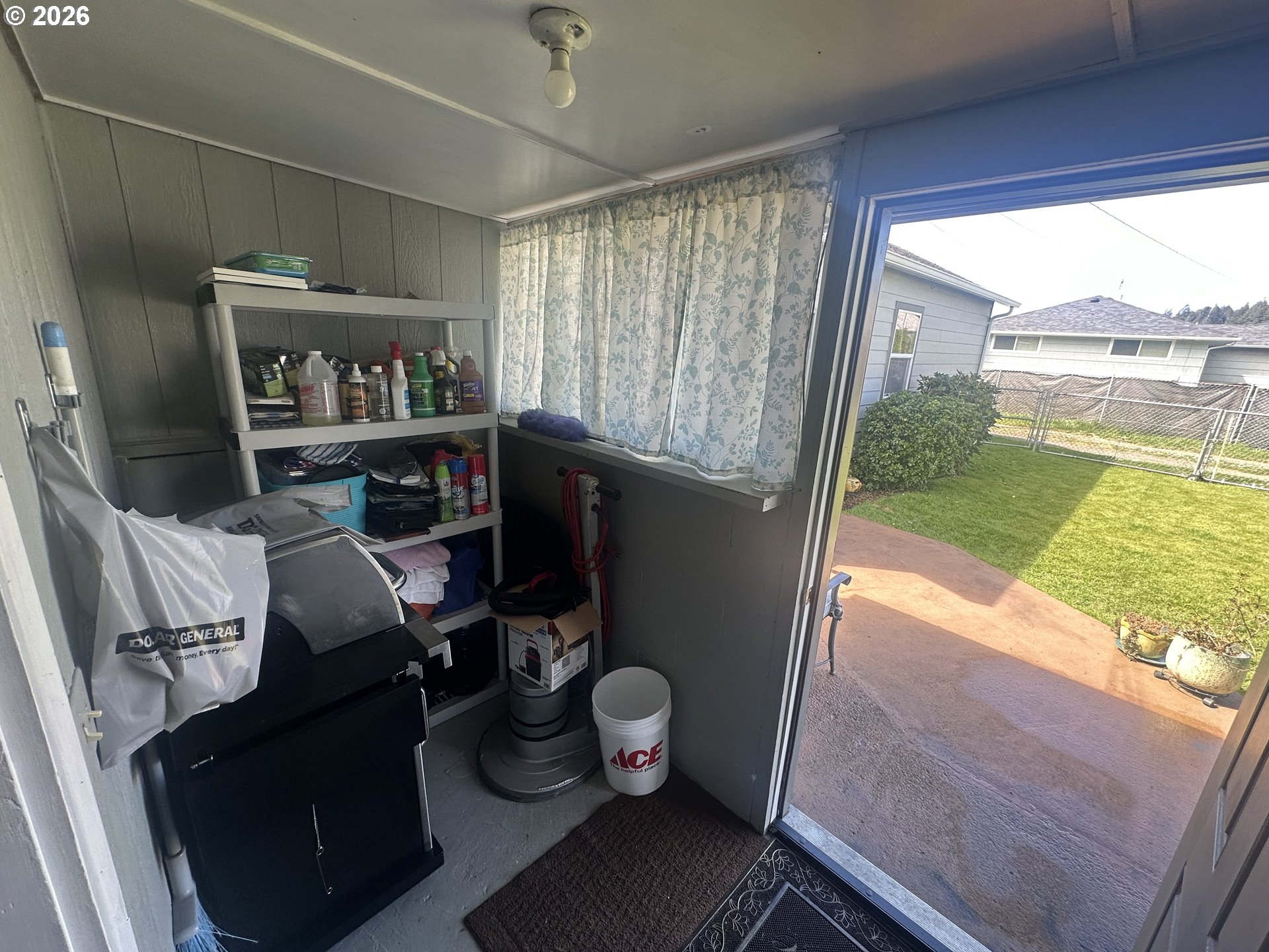 2063 Alder Avenue Reedsport, OR 97467 - Photo 13 of 29 a living room with furniture and a floor to ceiling window